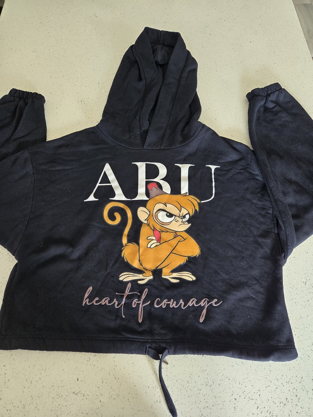 Heart of Courage Black Hoodie with Orange Monkey Graphic